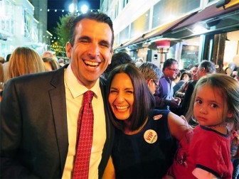 Sam Liccardo, celebrating here with wife Jessica and a borrowed baby, will face off against Dave Cortese in November for mayor of San Jose.