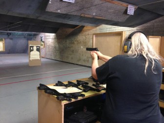 Nikki Stallard shoots a handgun during target practice at the Santa Clara Valley Rifle Club.