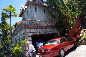 Bruce Nickerson outside his castle-style San Carlos home. (Photo by Jennifer Wadsworth)