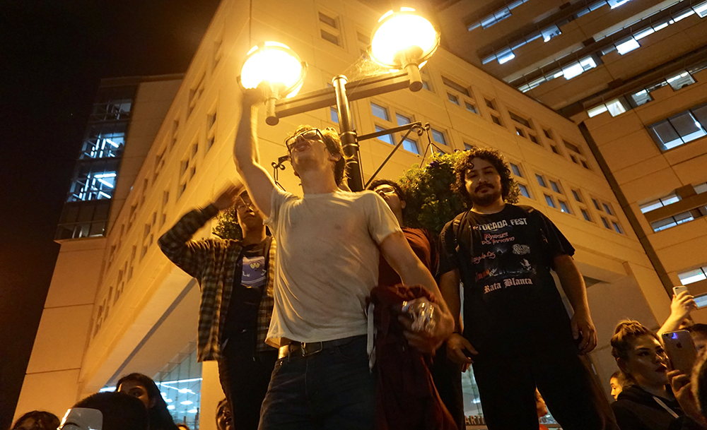 Protesters stand outside the MLK library in San Jose. (Photo by Jennifer Wadsworth)