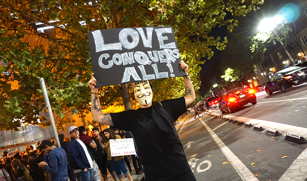 A protester outside the Martin Luther King Jr. Library in downtown San Jose. (Photo by Jennifer Wadsworth)