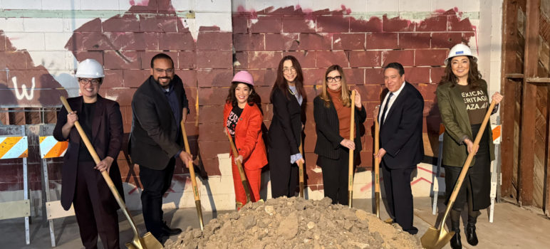 Community leaders hold shovels at the La Placita groundbreaking.